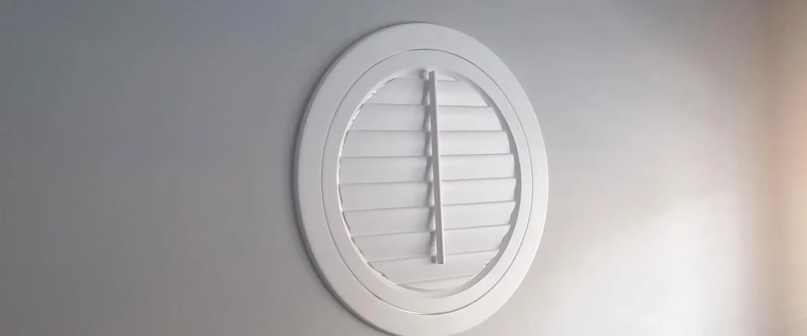 A closed round shutter fitted in a circular window